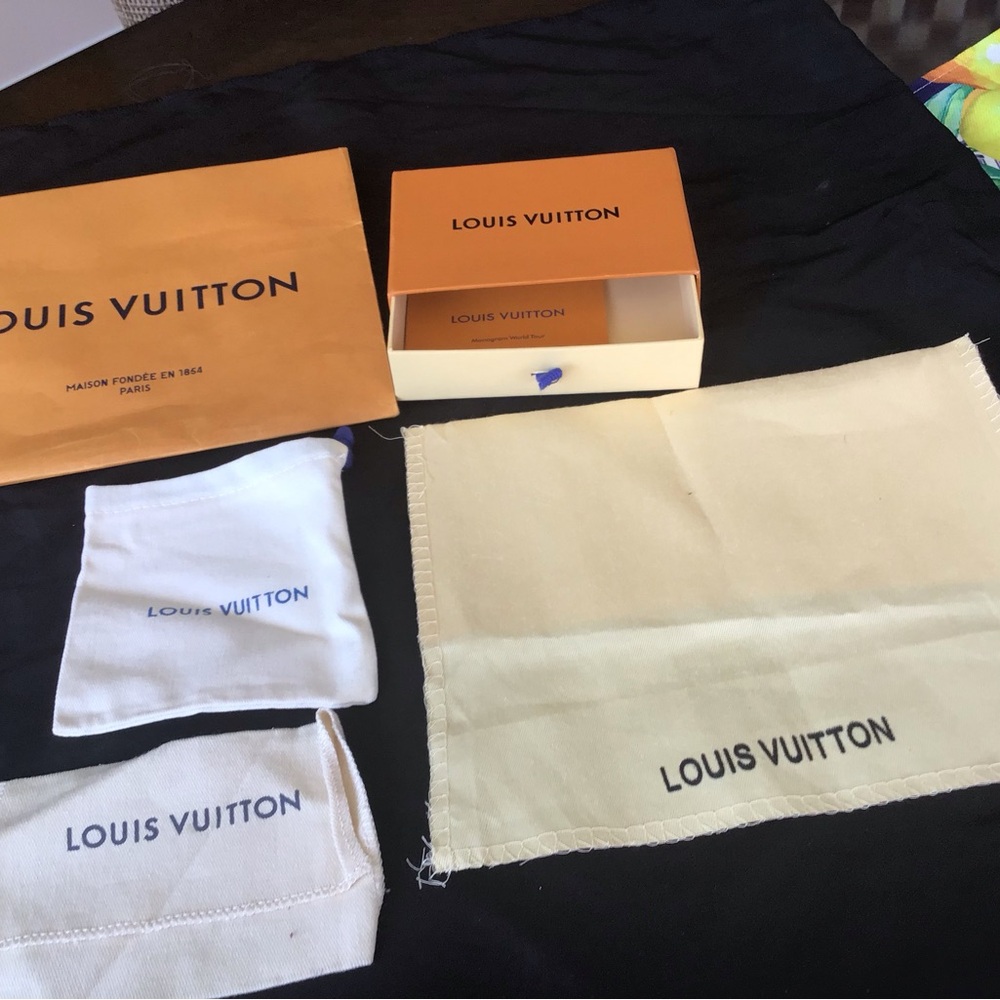 Louis Vuitton box, shopping bag and three storage bags